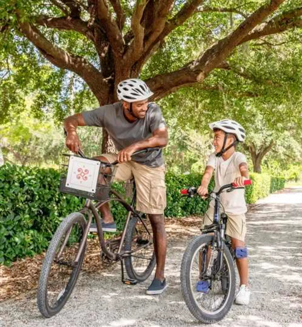Caribe Royal multigeneraional family vacation father and son riding bikes